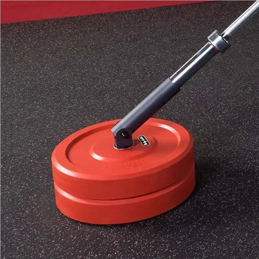Rote Hantelscheiben mit Langhantel auf Fitnessboden – ideal für Homegym & Krafttraining