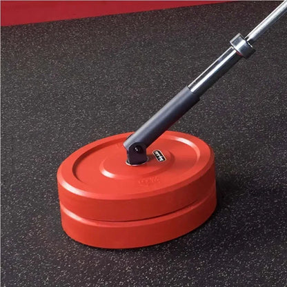 Rote Hantelscheiben mit Langhantel auf Fitnessboden – ideal für Homegym & Krafttraining